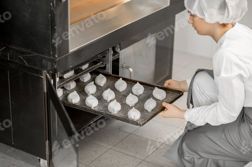 Preview: Baker putting buns into the oven