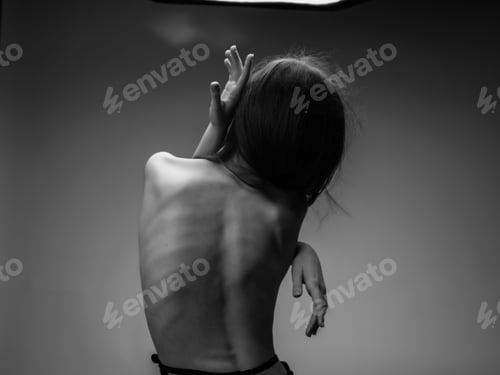 Preview: woman with naked back posing studio isolated background