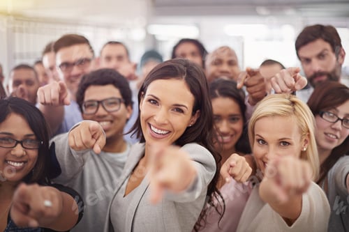 Preview: They want you on their team. Portrait of a group of smiling businesspeople pointing at the camera.