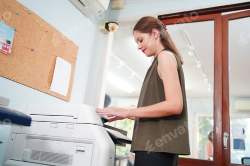 Preview: Business Young Woman Copying Document With Photocopy In Office