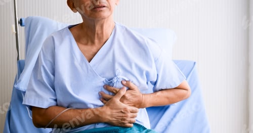Preview: Male patient hasing chest pain on sickbed at hospital room.