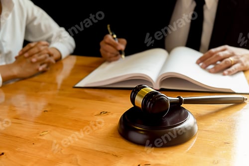 Preview: Judge gavel with Justice lawyers having team meeting at law firm background