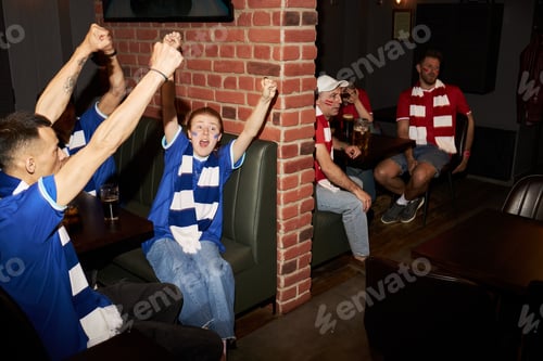 Preview: Group of Young Soccer Fans Cheering and Celebrating Team Success