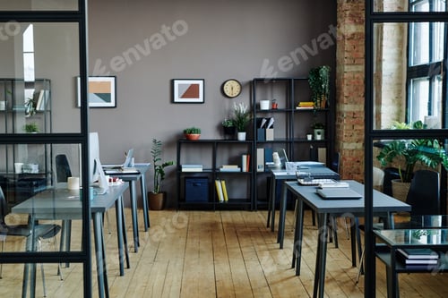 Preview: Interior of spacious modern openspace office with computers on desks