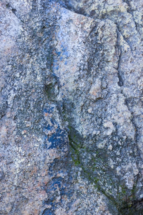 Preview: Granite Texture Close Up. Granite Rocks With Porous Surface. Background From Solid Stone. Pattern