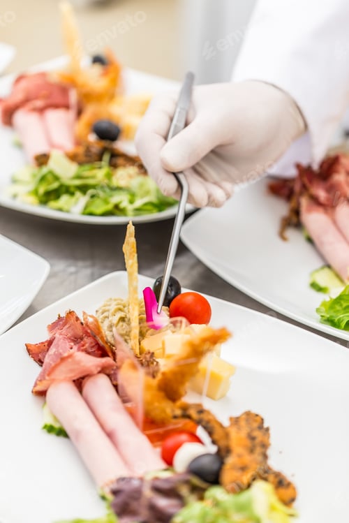 Preview: Chef garnishing delicious dish
