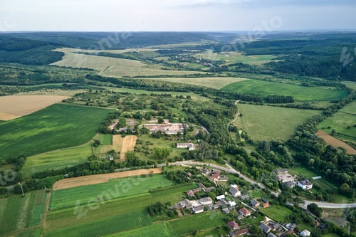 Preview: Aerial landscape view of green cultivated agricultural fields with growing crops