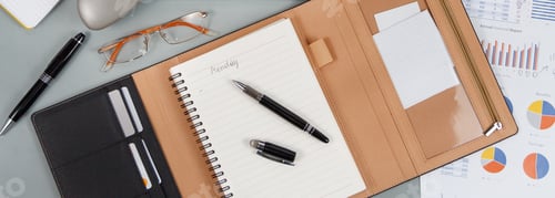 Preview: Opened agenda with handwritten MONDAY on a grey