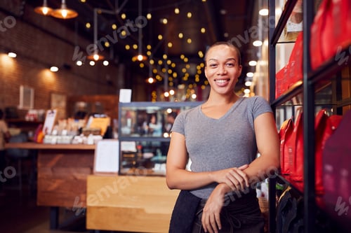 Preview: Portrait Of Female Coffee Shop Owner Standing By Counter
