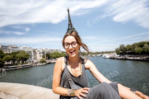 Preview: Woman with toy Eiffel tower in Paris