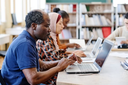 Preview: Migrant Students Using Laptops