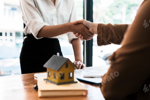 Preview: Successful agreement , estate,home buying contract concept, buyer shaking hand with bank empoyees