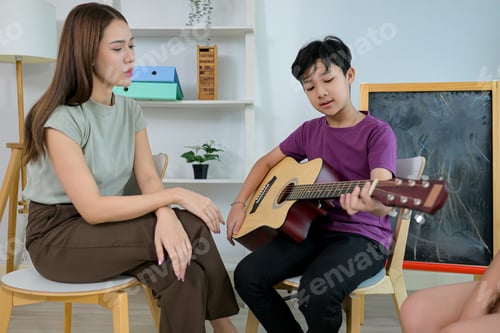 Preview: Guitar Class, Teacher and students in music classroom