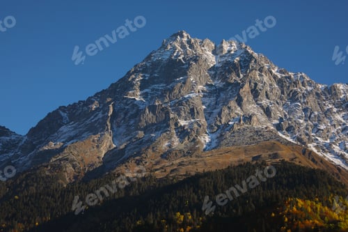 Preview: Picturesque view of beautiful high mountain under blue sky on sunny day
