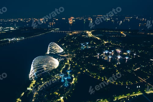 Preview: Aerial view of illuminated expressway city skyline at night with bright lights, modern urban