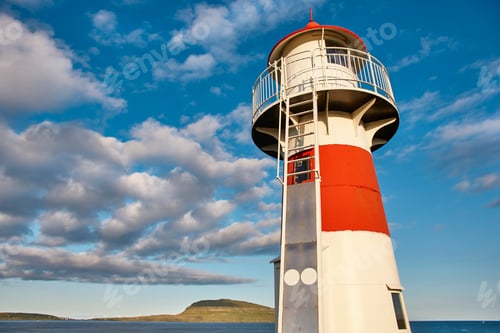 Preview: Red and white picturesque lighthouse in Faroe islands, Torshavn harbor