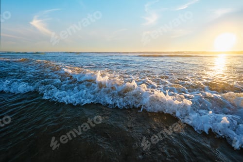 Preview: Atlantic ocean sunset with surging waves at Fonte da Telha beach, Portugal