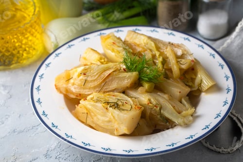 Preview: Organic Baked Fennel Bulbs with Salt and Pepper. Fennel dish with olive oil.