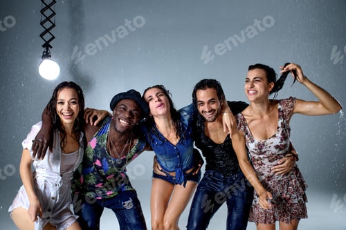 Preview: Smiling people standing in the rain embrace indoors