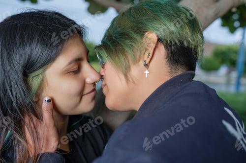 Preview: Lesbian lovers about to kiss each other outdoors