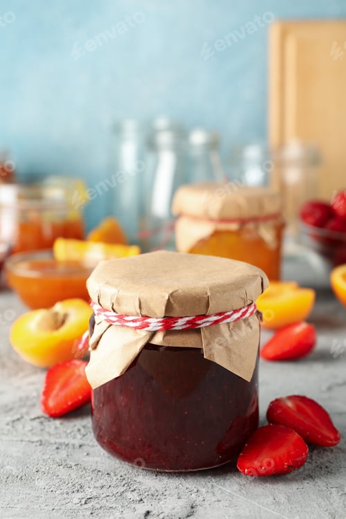 Preview: Composition with jam and ingredients on gray table, space for text