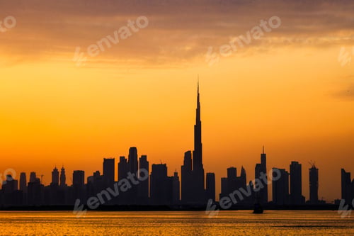 Preview: Silhouette view of the skyline of Dubai city against beautiful sunset sky