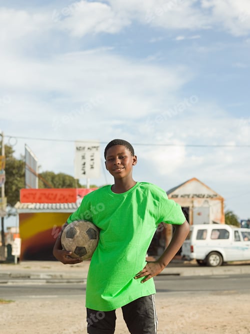 Preview: Teenage african boy with football