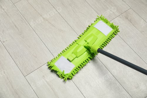 Preview: Microfiber mop on wooden floor, space for text