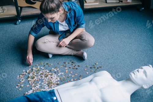 Preview: woman playing with puzzles with manikin near by, perfect relationship dream concept