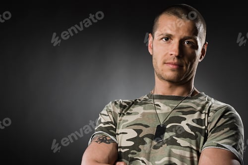 Preview: Portrait of a mid adult man wearing a dog tag