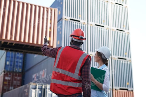 Preview: Foreman control loading Containers box from Cargo freight ship for import export.