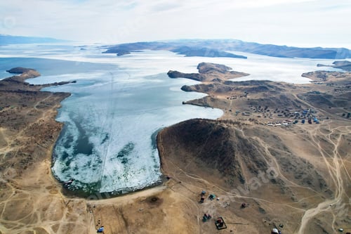 Preview: Beautiful aerial view of Lake Baikal in spring, the time of melting ice. Ice in the bays.