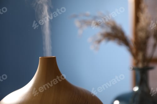 Preview: Modern aroma lamp against blurred background, closeup