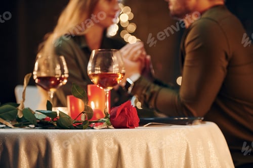Preview: Closeness of the people. Young lovely couple have romantic dinner indoors together