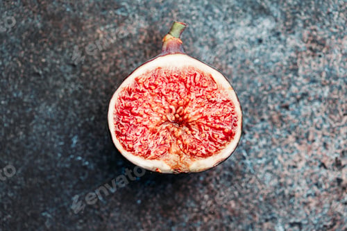 Preview: Macro photography of a fresh ripe cutted fig on the textured background.
