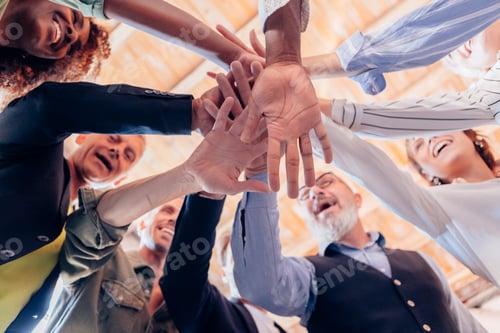 Preview: group gathers in a circle and gives energy with joined hands after a team building