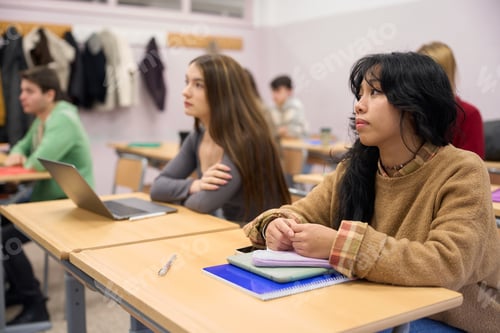 Preview: Students in Classroom Listening Attentively to the Teacher
