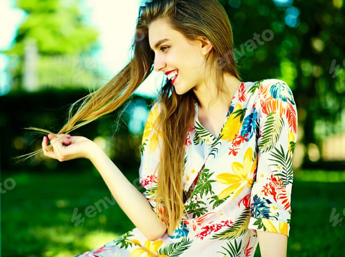 Preview: Beautiful young woman posing outdoors in summer clothes