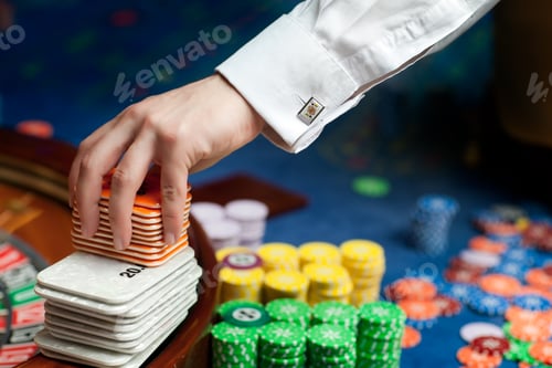 Preview: Cufflinks and Gambling Chips on a Roulette Table