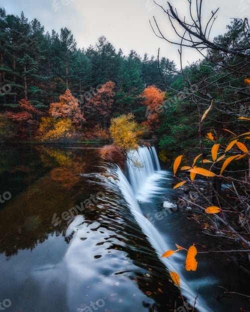 Preview: Amazing waterfall between autumn forest