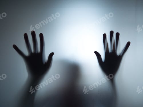 Preview: Silhouette of two hands on a blurred window