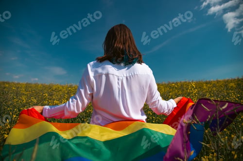 Preview: Young woman with LGBT flag.