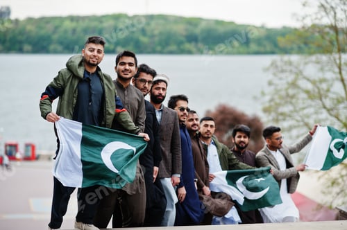 Preview: Group of pakistani man wearing traditional clothes salwar kameez or kurta with Pakistan flags.
