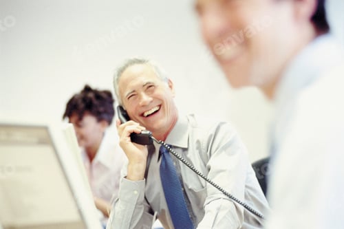Preview: Businessman on telephone in office