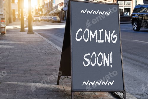 Preview: Chalkboard sign on sidewalk proclaiming Coming Soon!