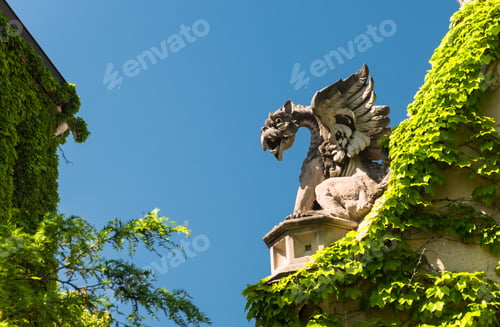 Preview: Big Stone Gargoyle On A Gate In A Park