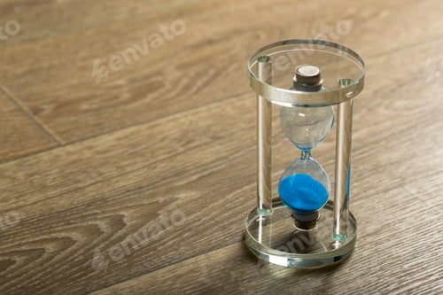 Preview: Time is passing. Blue hourglass close up