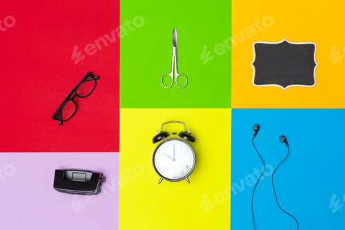 Preview: school supplies at colorful paper background