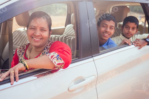 Preview: indian family driving boys to school In front of house gates