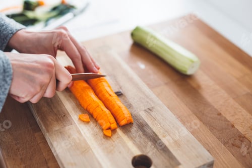 Preview: Young mommy cooking healthy vegetable meal for baby. Correct food is crucial for health.